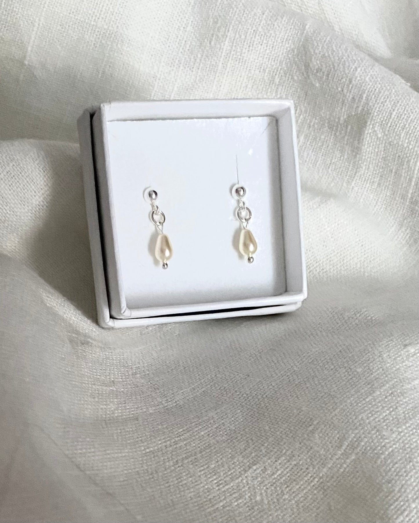 Stud earrings with a pearl drop, sterling silver