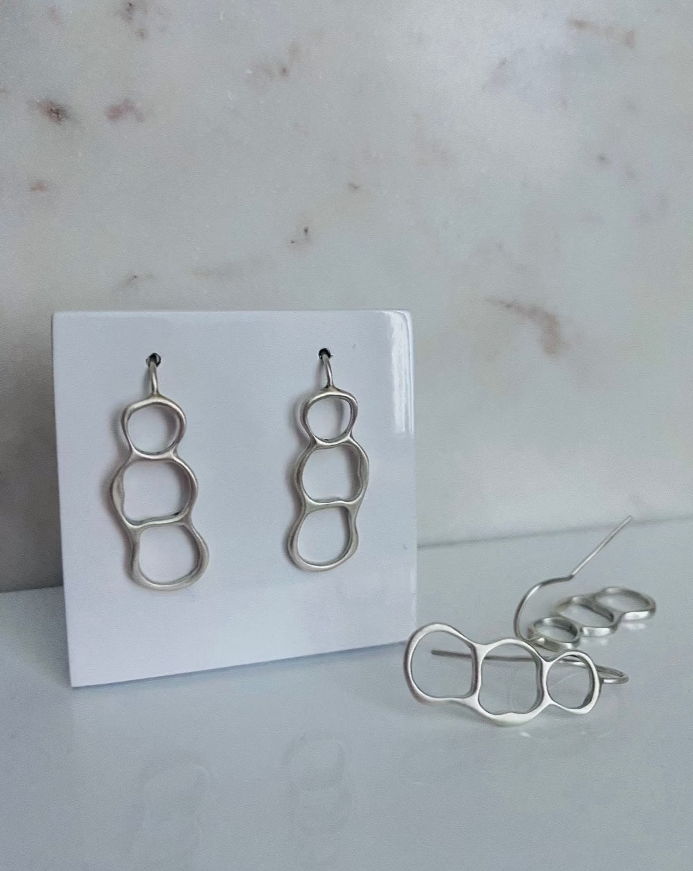 Beach Stones, a pair of earrings with a hook